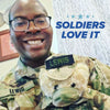 Glitched image of a smiling person in uniform with text: SOLDIERS LOVE IT—like the ZZZ BEARS Sgt. Sleeptight Army Teddy Bear, a unique kids' sleep aid with storybook & sleep system.